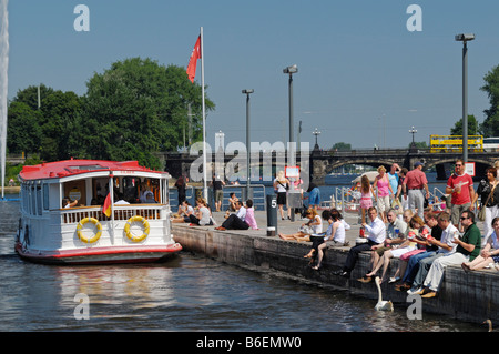 People on the Alster Lake steamer quay in Hamburg, Germany, Europe Stock Photo