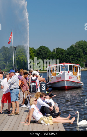 People on the Alster Lake steamer quay in Hamburg, Germany, Europe Stock Photo