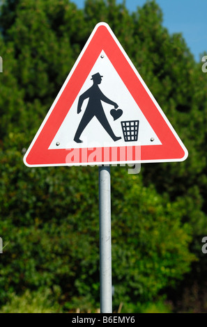 Traffic sign with a man throwing his heart in a garbage bin, symbolic photo for lovesickness Stock Photo