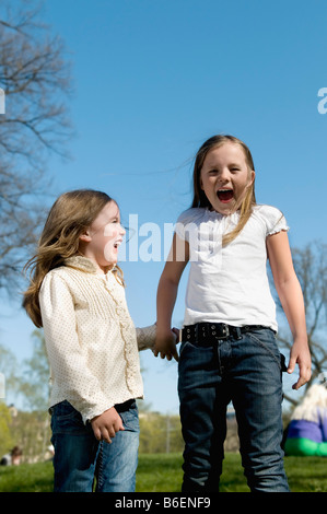 Sisters holding hands Stock Photo