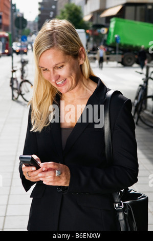 happy businesswoman with cellphone Stock Photo