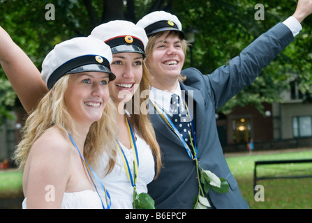 Students with raised arms Stock Photo