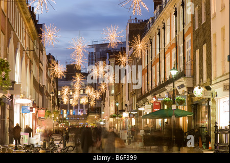 People shopping Christmas time South Molton Street W1 London United Kingdom