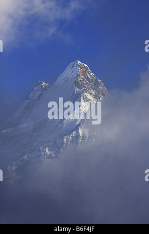 Snow covered Schreckhorn mountain and cloud in Switzerland, Europe ...