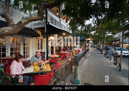 Couple outside cafe on Duval street in the early evening, Old Town, Key West, Florida Keys, USA Stock Photo