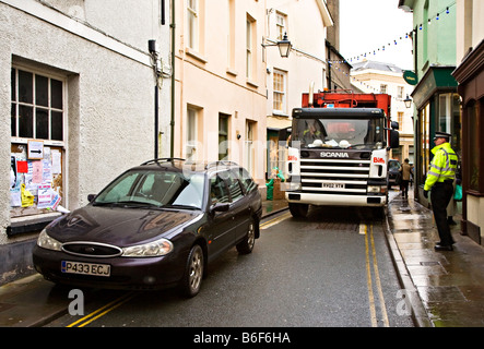 Car parked on double yellow lines in no waiting zone blocking road with police attending Brecon Wales UK Stock Photo