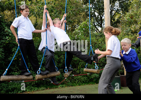 Bullying in a primary school play area Stock Photo