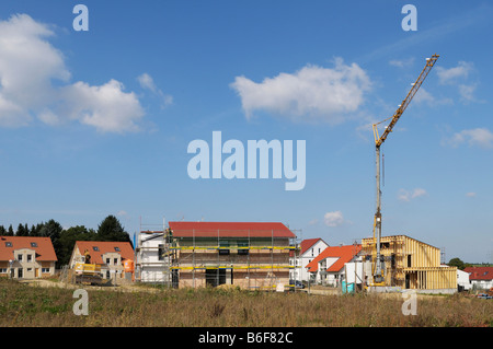 Development area, different houses in different stages of completion, including a timber building, Mettmann, North Rhine-Westph Stock Photo