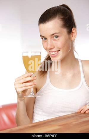 Girl with glass of fruit juice Stock Photo