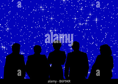 five people watching a video of night sky Stock Photo