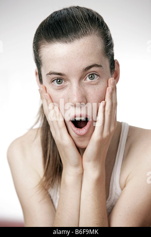 Teenage girl, woman, 17 year-old, acting surprised Stock Photo