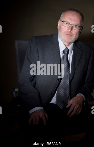 Businessman sitting in an office chair Stock Photo