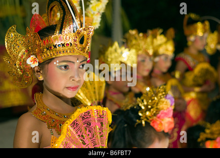 Balinese children present the traditional Legong dance to tourists in Kuta, Bali, Indonesia, Asia Stock Photo