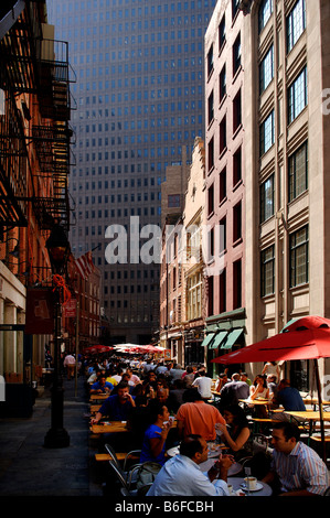 Busy street eateries during lunch time in Downtown, skyscrapers at back, New York City, USA Stock Photo