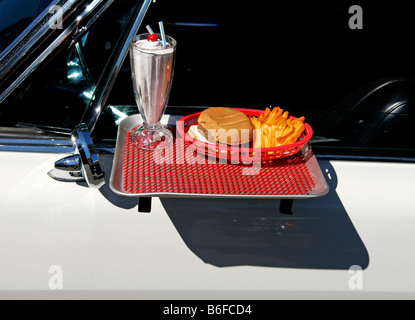 Drive-in restaurant tray attached to a 1965 Pontiac at a Classic Car Show in Belvidere, New Jersey, USA Stock Photo