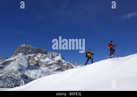 Snowshoe hikers on the Plaetzwiese Meadow, at back the Hohe Gaisl Mountain, High Puster Valley or Alto Pusteria, Bolzano-Bozen, Stock Photo