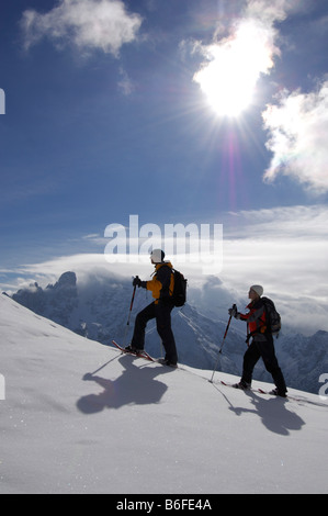 Snowshoe hikers on the Plaetzwiese Meadow in front of the Monte Cristallo Massif, High Puster Valley or Alto Pusteria, Bolzano- Stock Photo