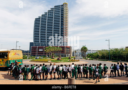 School children waiting for a bus in Durban, Kwazulu-Natal, South Africa Stock Photo