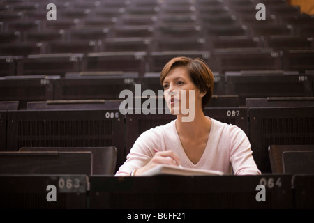 Female student in the lecture hall Stock Photo