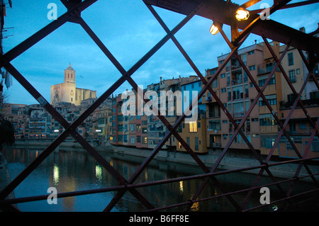 Cathedral and hanging houses over Onyar river from Iron Bridge GIRONA Catalonia Spain Stock Photo