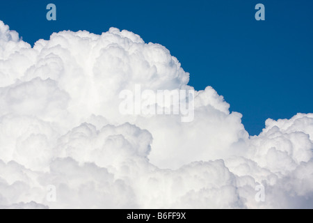 White cumulus clouds against blue sky