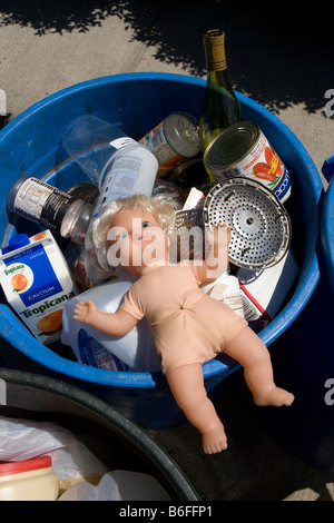 Rubber doll with recyclable garbage in Brooklyn NY Stock Photo
