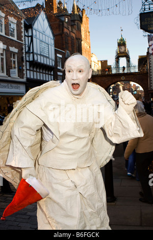 UK Cheshire Chester city centre at Christmas Steve Parry human statue Ghost of Xmas past Stock Photo
