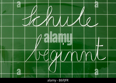 German Handwritten Text On A Chalkboard With Grid Schule Ist Aus