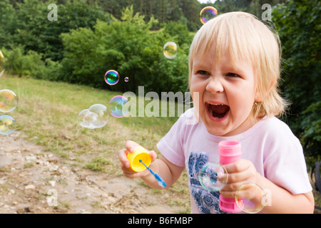 Girl, 5 years old, with bubbles Stock Photo