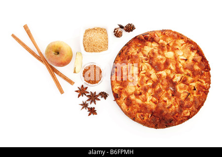 Apple pie with fresh apples, cinnamon, sticks of cinnamon and sugar Stock Photo
