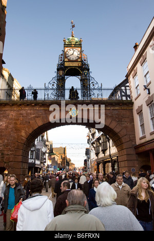 UK Cheshire Chester Eastgate Street at Christmas Jubilee clock above crowds of shoppers Stock Photo