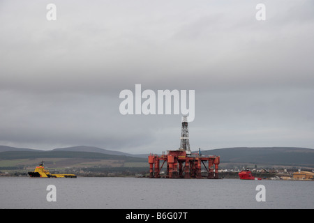 Oil drilling platform Essar Wildcat being manoeuvred at Invergordon on the Cromarty Firth Highlands Scotland Stock Photo