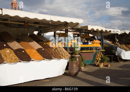 Marrakech Morocco North Africa December Stalls selling dried fruit nuts and freshly squeezed orange drinks in Jemaa el Fna Stock Photo