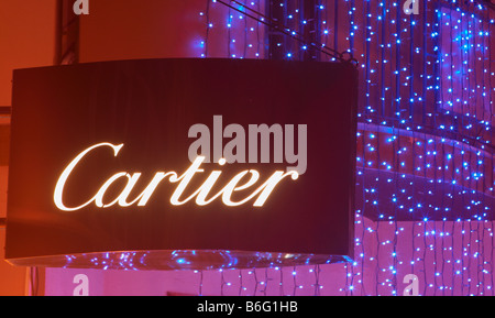 Cartier sign outside Cartier Jewellers shop in Spain. Christmas lights in the background. Stock Photo