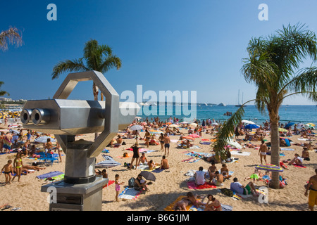 People sunbathing on the beach at Cannes, France Stock Photo - Alamy