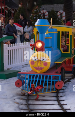 Toy Locomotive of the Santa Claus Railroad at Christmas in the Park at the Plaza de Cesar Chavez in central San Jose, CA Stock Photo