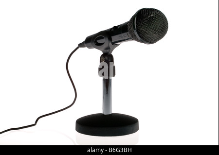 Black microphone with lead on a stand isolated on a white background Stock Photo