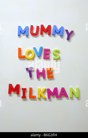 Mummy Loves the Milkman spelt in alphabet fridge magnets Stock Photo