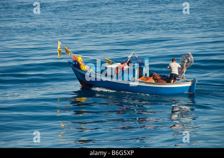 Italian fishermen on a fishing boat in the Mediterranean sea. Stock Photo