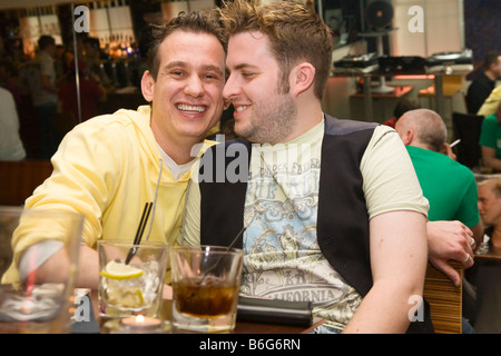 A gay couple sitting together in a London restaurant (London, England) Stock Photo