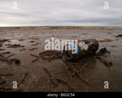 An empty beer can washed up on the beach at Blackpool Stock Photo