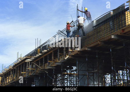 High Rise Building under construction,  workers, pouring concrete, forming concrete forms, Miami. Stock Photo