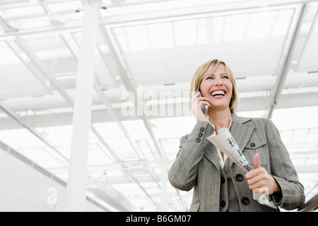 Woman smiling using cell phone Stock Photo