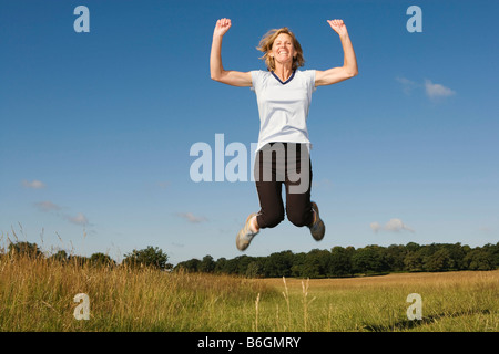 Woman runner jumping in air