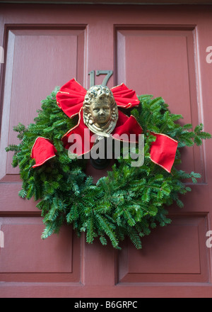 Christmas Wreath with cherub hung on the front door in the West Village neighborhood of Manhattan ©Stacy Walsh Rosenstock/Alamy