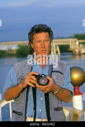 USA AMERICA Well known travel photographer Nik Wheeler holds a Nikon camera on photographic assignment in Mississippi. Stock Photo