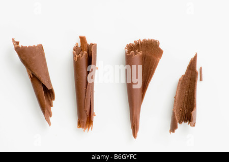Four chocolate shavings on white Stock Photo