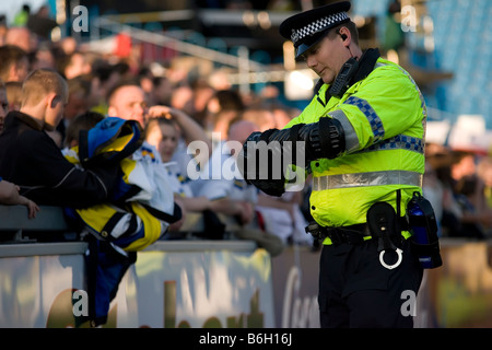 English Police man at English league football soccer match Stock Photo