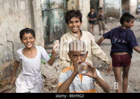 Kids playing naked in the streets of New Delhi during the monsoon New