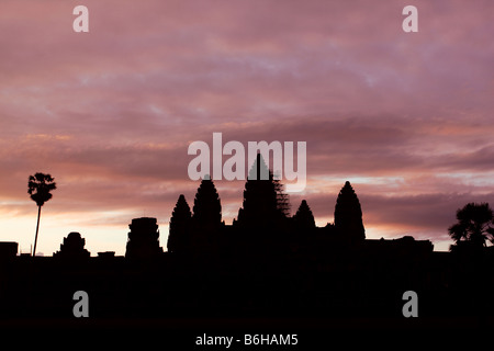 Black shape of Angkor Wat temple taken before Sunrise with a pinkish sky, Siem Reap Cambodia Stock Photo